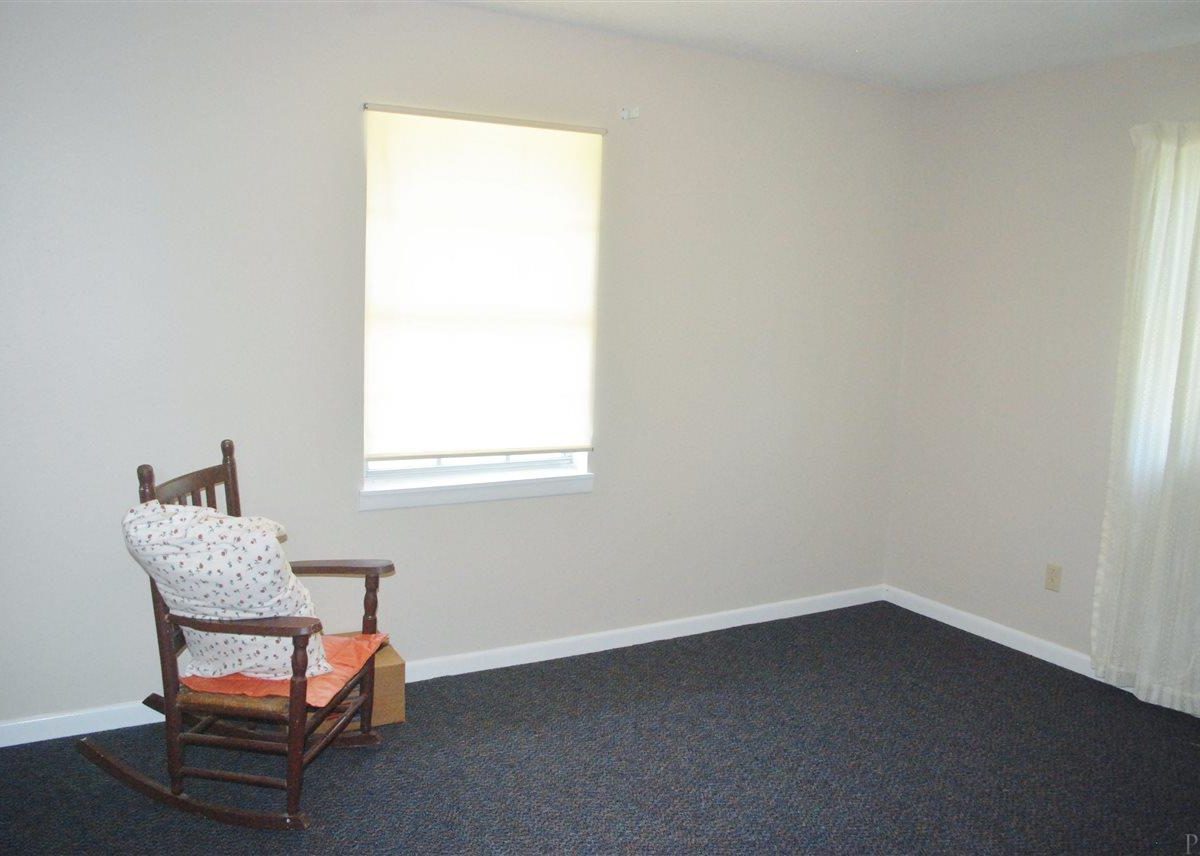 empty room with rocking chair