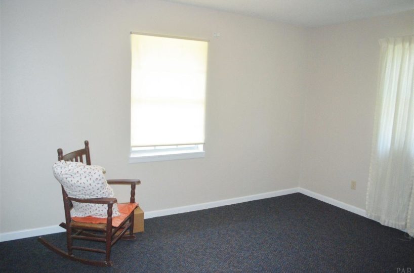 empty room with rocking chair
